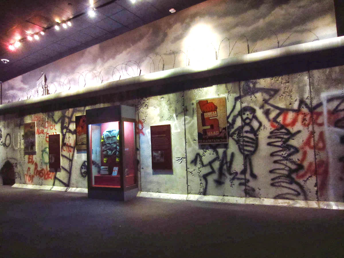 Replica of the Berlin Wall. Note hole in the wall on far left. If you stick your head through, a recording of ferocious dogs begin barking.