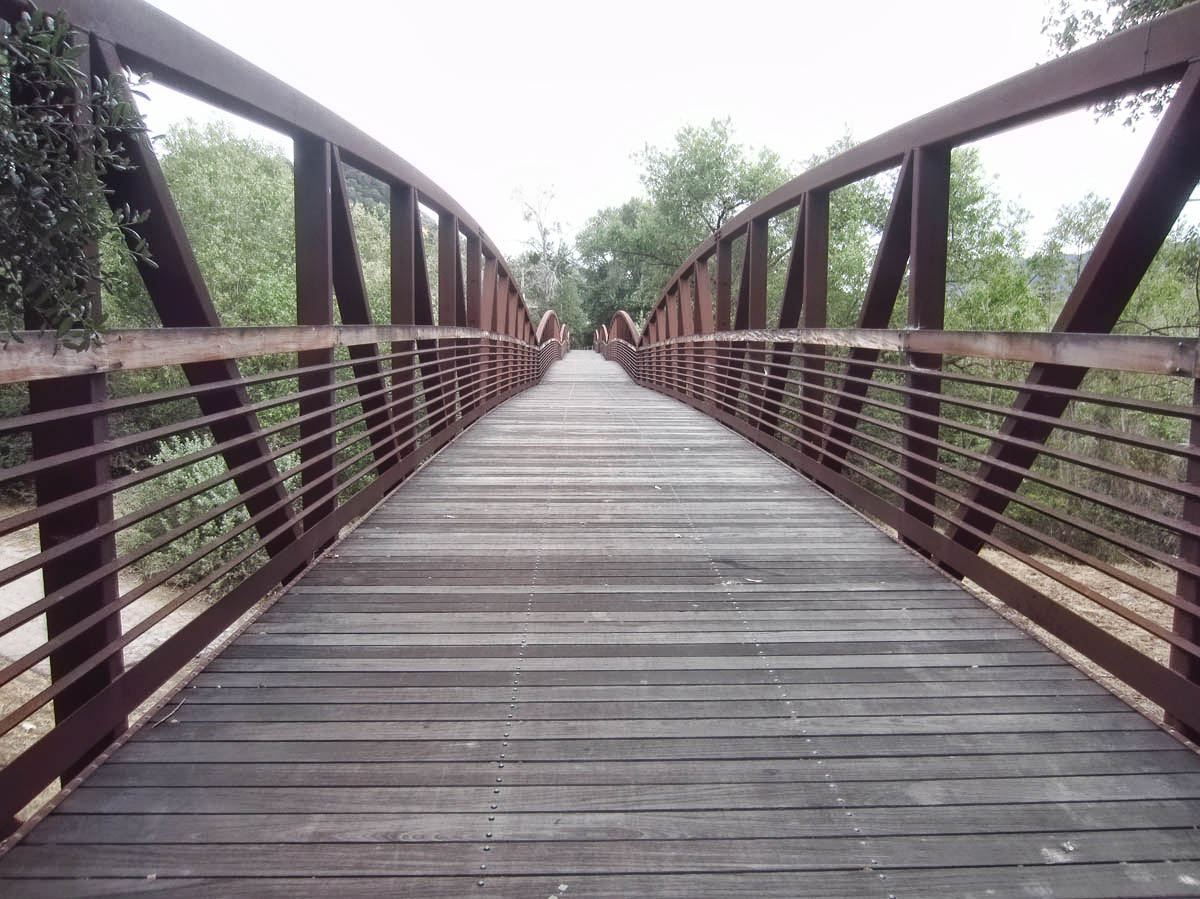 Cool bridge over San Antonio Creek, built in 2012 of rust-colored steel and Brazilian hardwood.