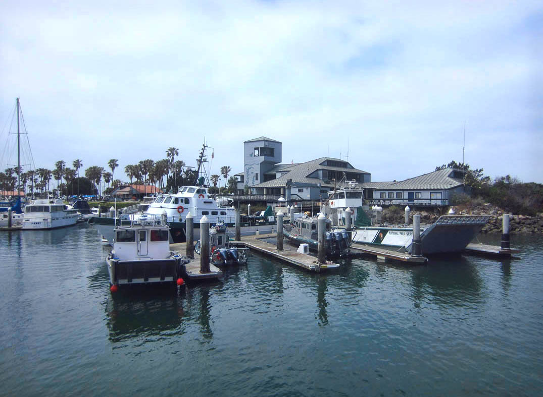 The tower and gray building are the Robert J. Lagomarsino Visitor Center in Ventura Harbor on the mainland. 