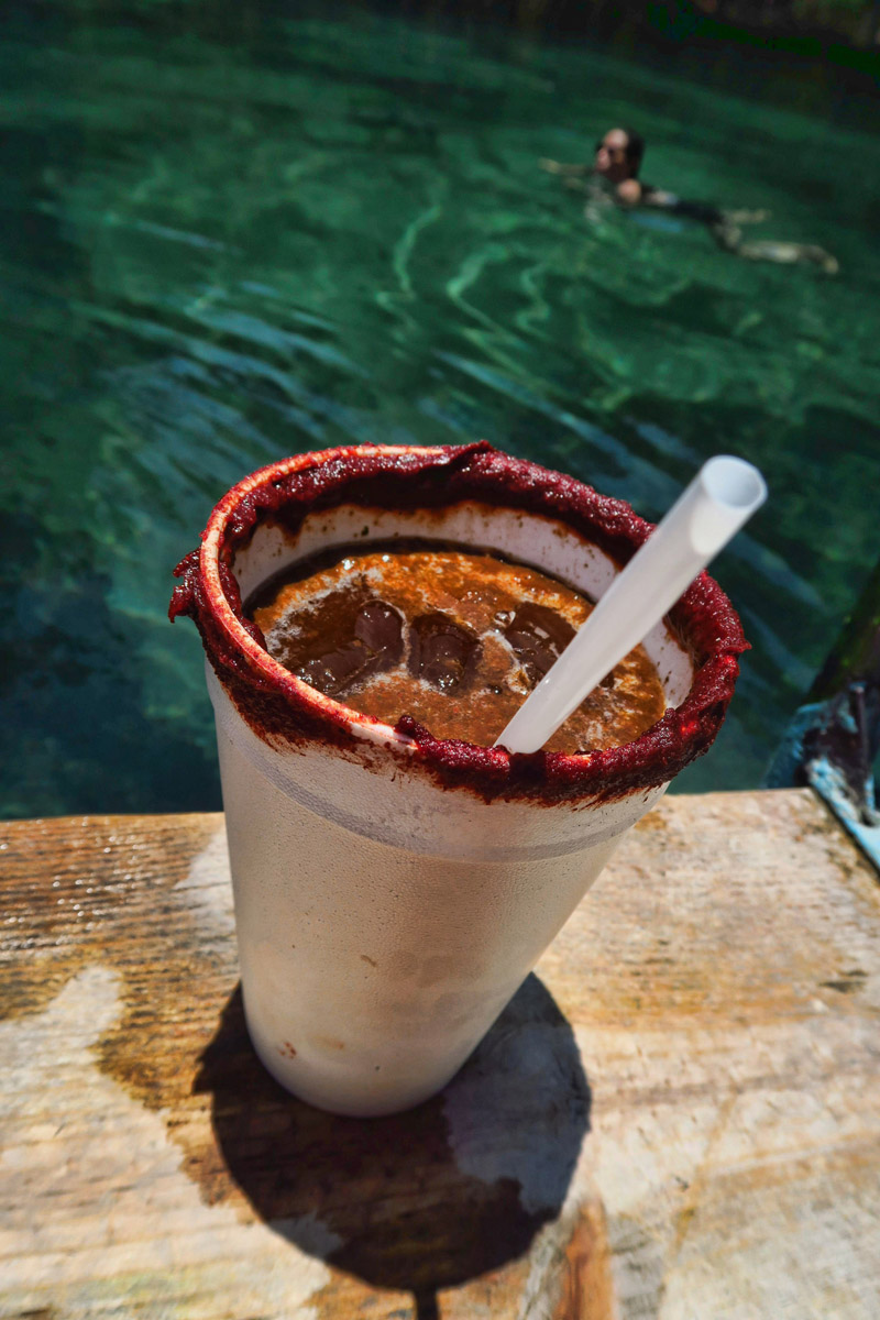 Media Luna's version of the Michelada includes lime, salt, tomato juice, and tamarind salt on the rim. Oh, and cerveza, of course! 